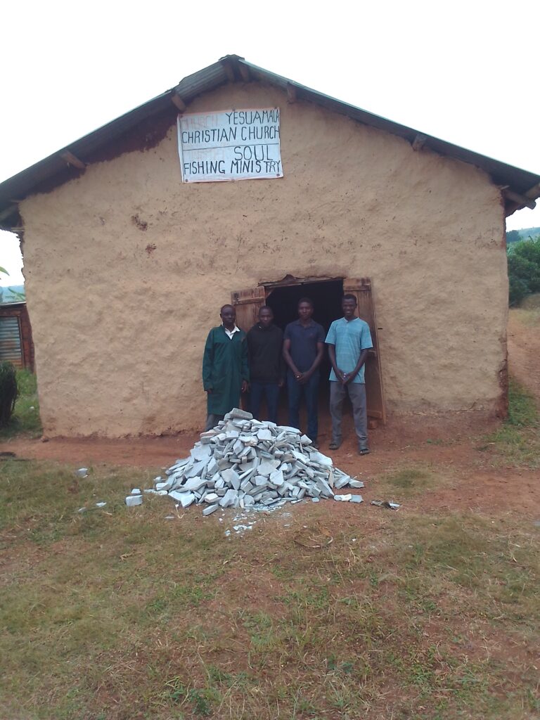 Pastor with ministers in front of church in Uganda