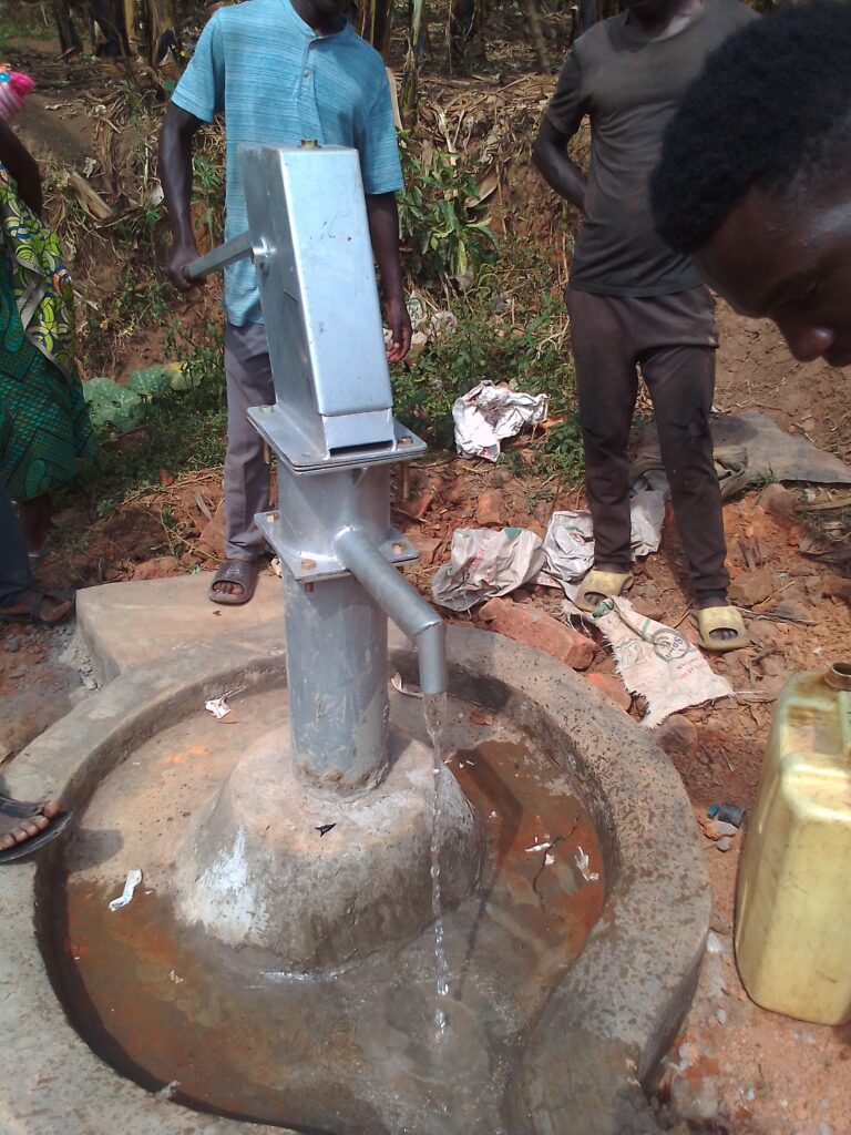 Drawing the first water from the well.